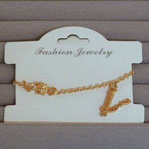 NWOT Gold Finished Chain Bracelet With V Pendant